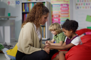 Teacher comforting Sturdent